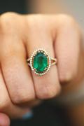 Oval Cut Emerald Ring - With Diamond Halo